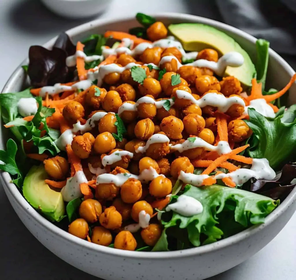 Fresh Buffalo Chickpea Salad served in a bowl with avocado slices
